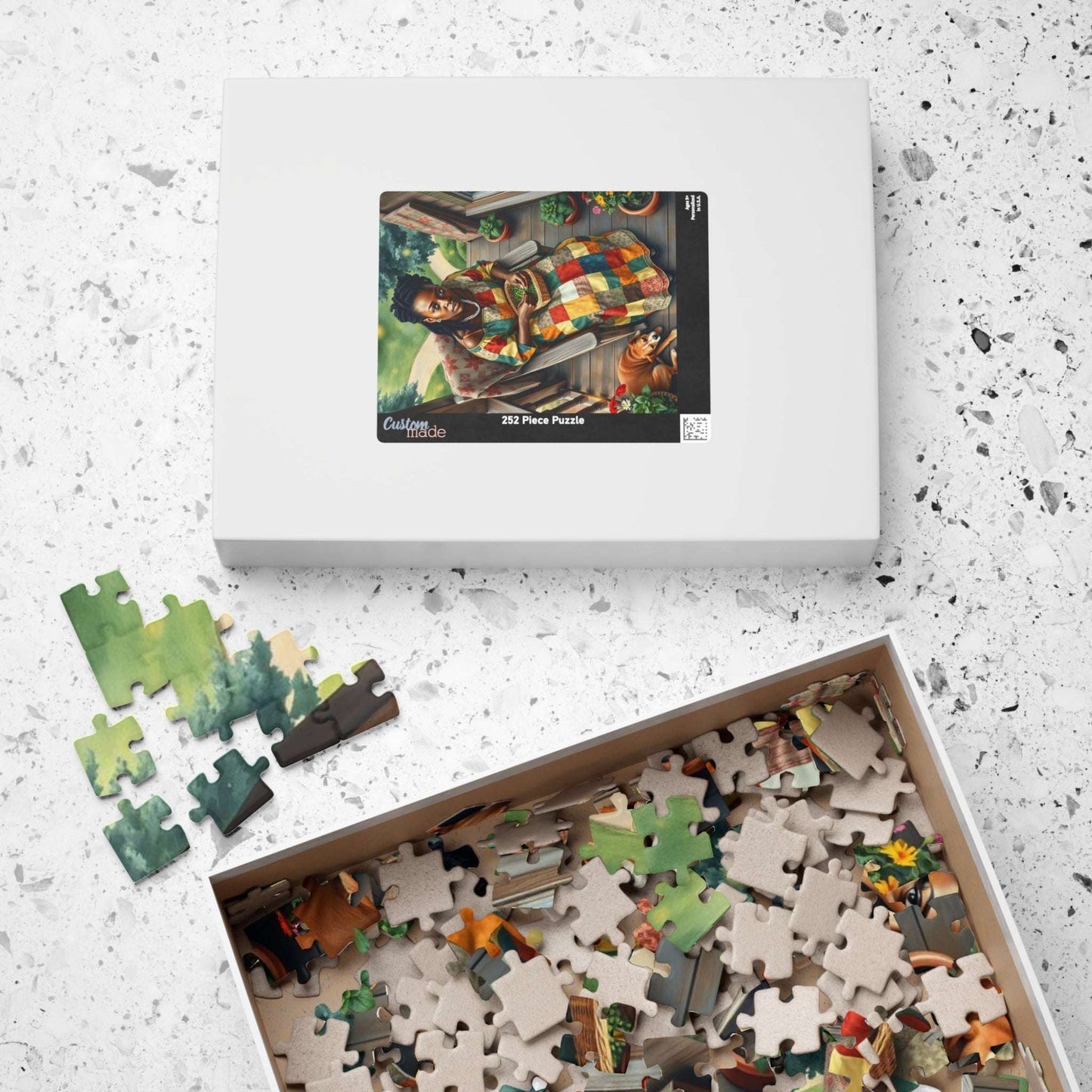 The Homemaker Jigsaw Puzzle – Black Woman Shelling Peas with Dog, Afrocentric Art, African American Artwork Puzzle The Puzzle Chest